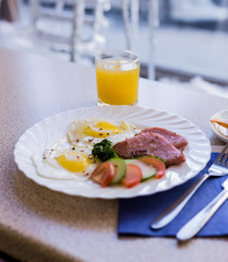 scrambled eggs with vegetables and sausage with coffee