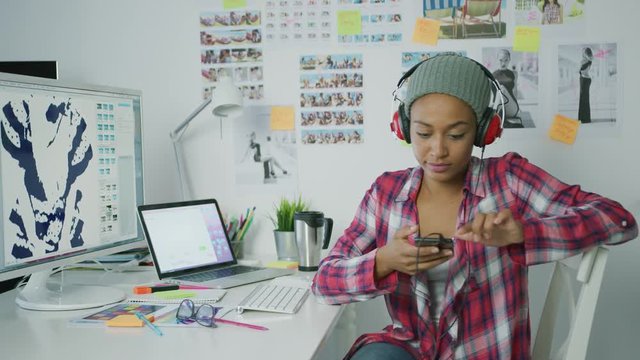 Trendy designer working with computer