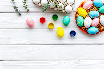 Traditional Easter eggs for paint on white wooden background top view space for text