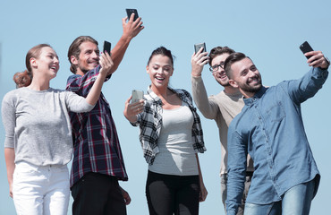 group of young people taking a selfie.