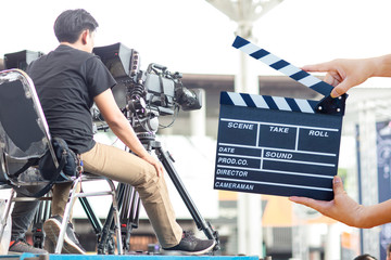 Man hands holding movie clapper.Film director concept.camera show viewfinder image catch motion in interview or broadcast wedding ceremony, catch feeling, stopped motion in best memorial day concept.
