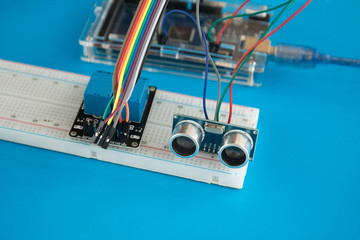 arduino programmed microcontroller with ultrasonic sensor and relay module