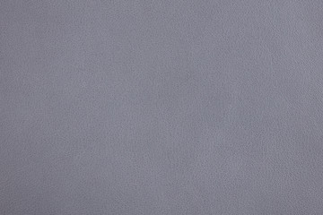 Background with greyish lilac artificial leather, close up – photo image
