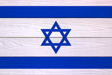 Israel flag painted on wooden background