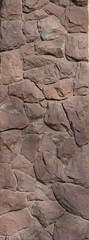 Texture decorative stone wall of uneven stones of natural origin