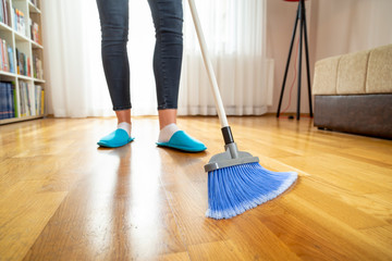 Woman sweeping floor