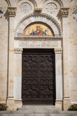 Wooden portal of an ancient Italian church.