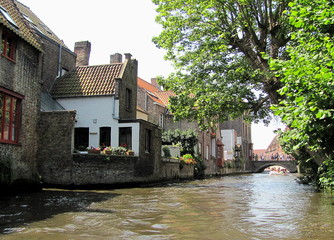 Fototapeta na wymiar Scenery with water canal in Bruges, Belgium.