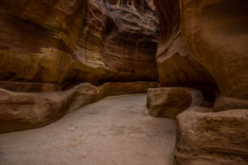 canyon natural rocks object dark narrow path way empty track between steep brown mountains 