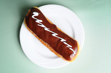 Cream-Filled Eclair Coated with Chocolate - Unhealthy Breakfast Eating