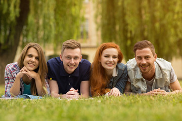 College friends chatting outdoors at the campus