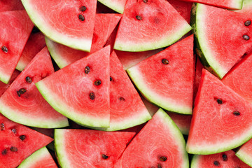 heap of watermelon slices as background - Powered by Adobe