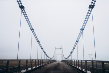 metal and concrete bridge with asphalt road