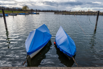 Naklejka premium Two covered boats in a small harbour of Hard on Lake Constance