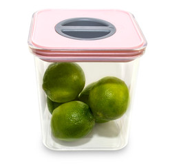 Limes in casserole on white background