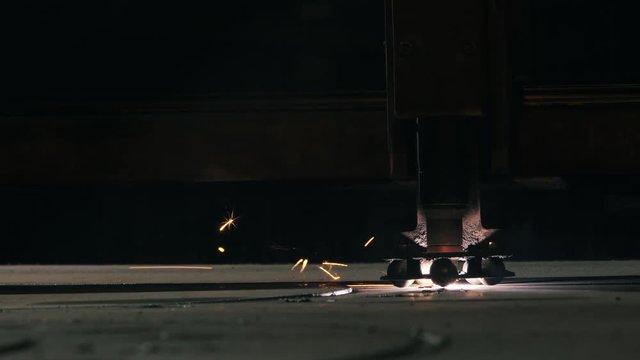 Side View Laser Cutter Cuts Part On A Sheet