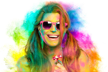 Beautiful woman covered in rainbow colored powder. Holi festival. Beauty spring concept