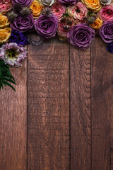Floral border on rustic wood vertical