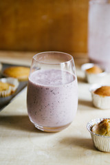Blueberry smoothies with lactose free almond milkbanana muffins, concept for healthy breakfast and snack.