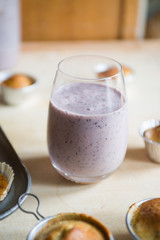 Blueberry smoothies with lactose free almond milkbanana muffins, concept for healthy breakfast and snack.