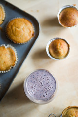 Blueberry smoothies with lactose free almond milkbanana muffins, concept for healthy breakfast and snack.