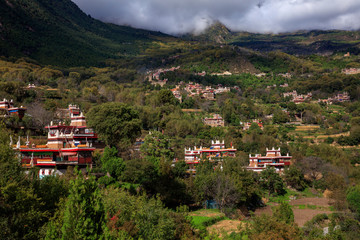 Fototapeta premium Danba County, Sichuan Province China. Zhonglu Township, Architectural Style of Jiuaju Ancient Tibetan Village. Traditional Tibetan buildings, Suopo towers, beautiful Chinese countryside. Wild West
