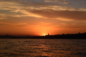 Fototapeta na wymiar Orange color sunset in Istanbul bosphorus