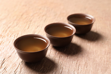 Cups of Tie Guan Yin oolong tea on table