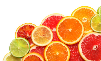 Slices of fresh citrus fruits on white background, top view