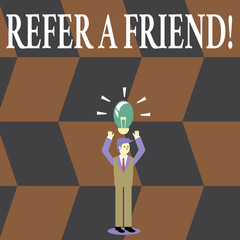 Writing note showing Refer A Friend. Business concept for direct someone to another or send him something like gift Businessman Raising Arms Upward with Lighted Bulb icon above