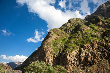 Mountains and the nature of the North Caucasus, the blue sky over high rocks in the beautiful gorge