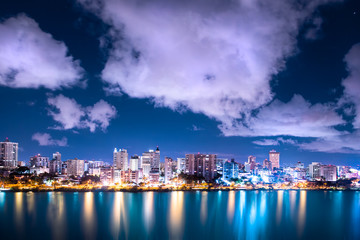 Beautiful Condado Beach, San Juan Puerto Rico seen at night with bay, buildings and lights