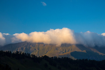 Mountains and the nature of the North Caucasus, the blue sky over high rocks in the beautiful gorge