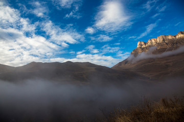 Mountains of the North Caucasus, mountain tops in clouds. Wild nature