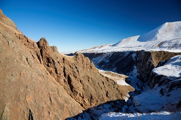 Mountains and the nature of the North Caucasus, the blue sky over high rocks in the beautiful gorge