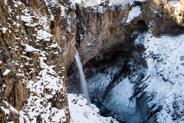 Winter falls in mountain rocks, the wild nature of the North Caucasus