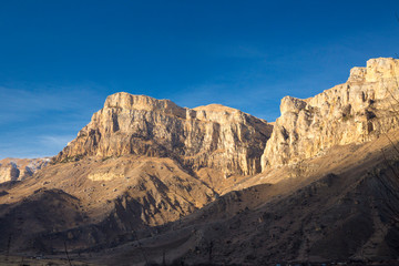 Mountains and the nature of the North Caucasus, the blue sky over high rocks in the beautiful gorge