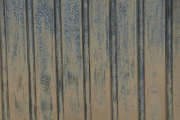 gray brown metal texture from dirty striped iron wall