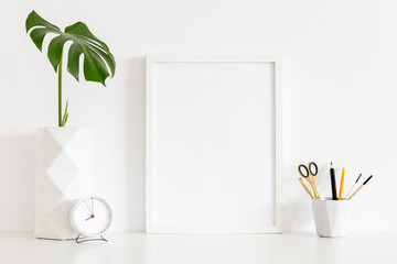 Poster frame mock up and monstera leaf.  © mallmo