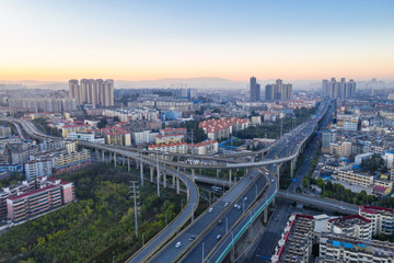 Naklejka na ściany i meble kunming city interchange in sunrise