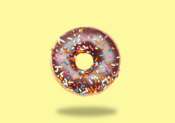 Chocolate donut on pastel yellow background.