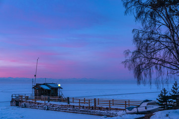 Frozen pier on the shore of Lake Baikal © tilpich