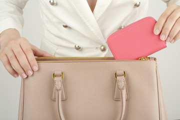 a scene of putting a wallet in a bag