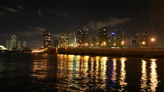 Timelapse of Miami Skyline and MacArthur causeway bridge at night in Florida, USA