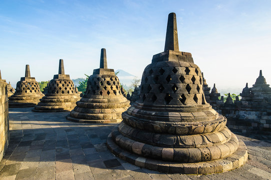 Indonesia, Java, Borobudur Temple Complex, stupas in early morning light