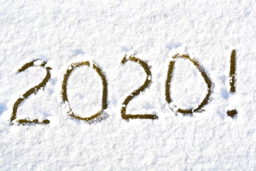 text 2020 written in the white snow on the ice