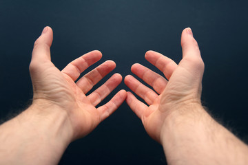 outstretched arms with open palms