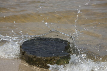 water splashes on rock
