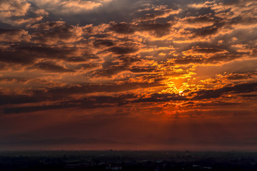 Sunset over buildings in center of Chiang Mai, Thailand. Colorful Sunset with CityScape.