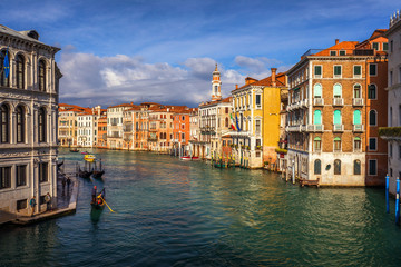 Rialto bridge in Venice, Italy. Venice Grand Canal. Architecture and landmarks of Venice. Venice postcard with Venice gondolas